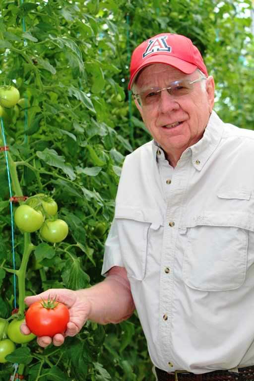 Dr Merle Jensen in an Agra Tech Solar Light Greenhouse